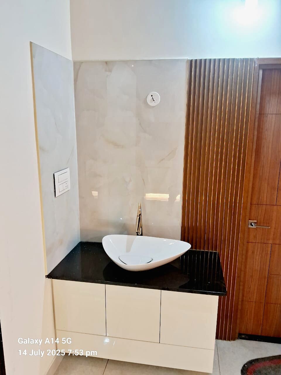 Compact Vanity Sink Wood Wall from an Abya completed interior project