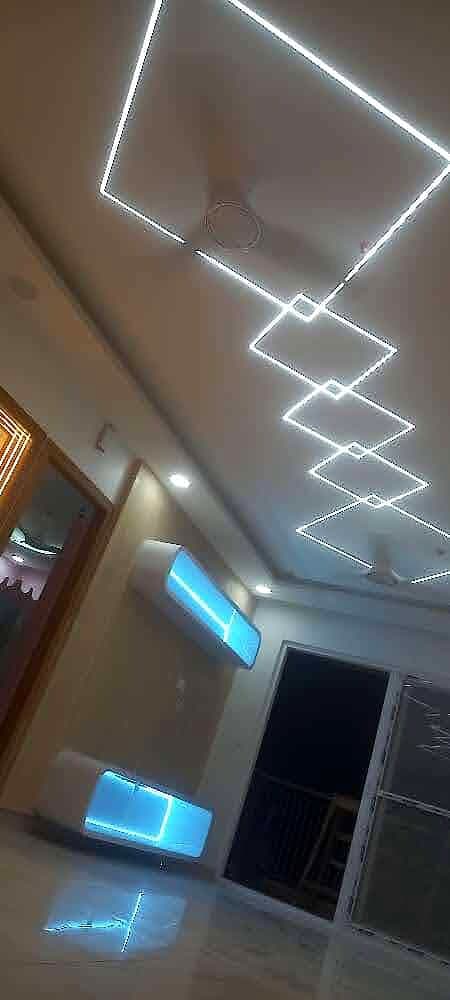 Geometric Led Ceiling Teal Wall from an Abya completed interior project