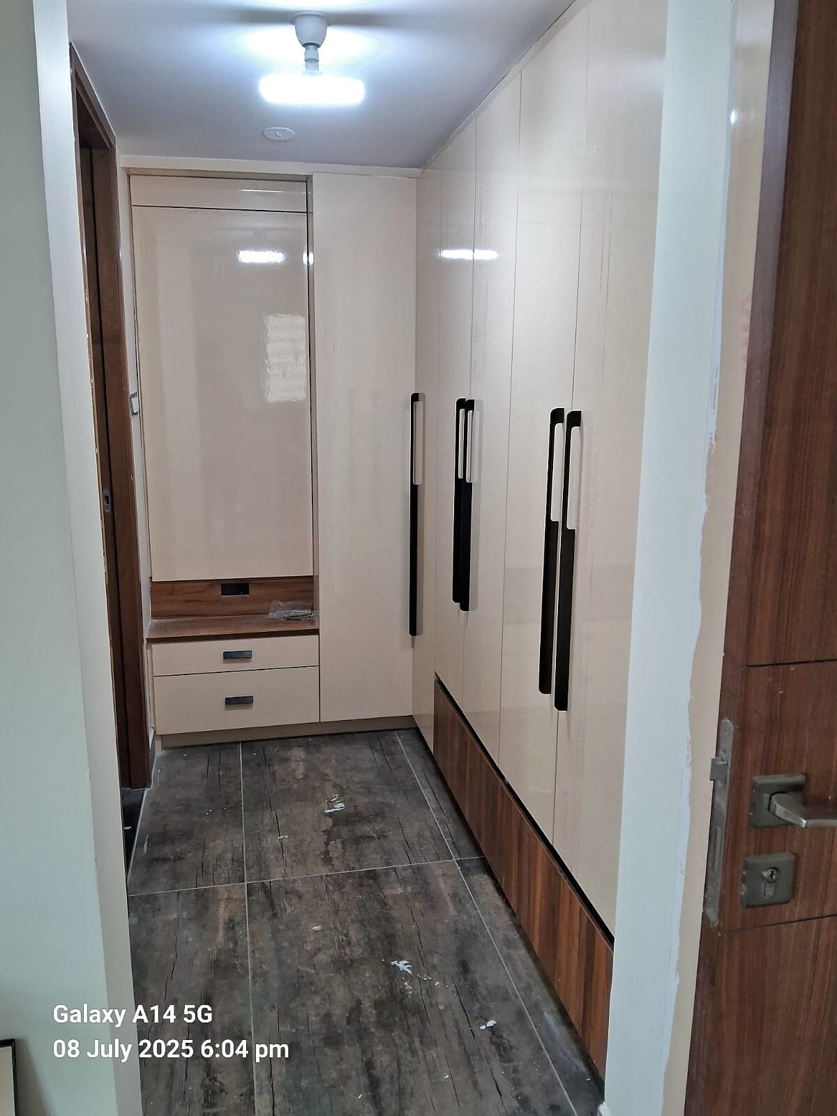 Hallway Wardrobes Dark Floor from an Abya completed interior project