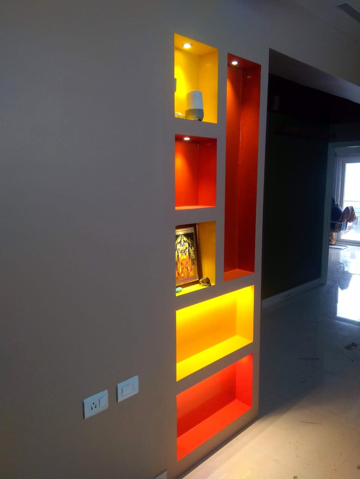 Illuminated Red Yellow Display Shelves from an Abya completed interior project