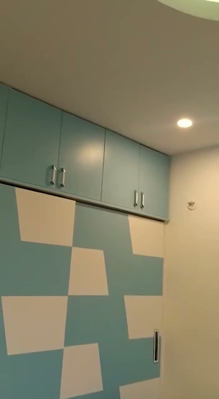 Kids Bedroom Blue Wardrobe And Cloud Ceiling Walkthrough Poster from an Abya completed interior project