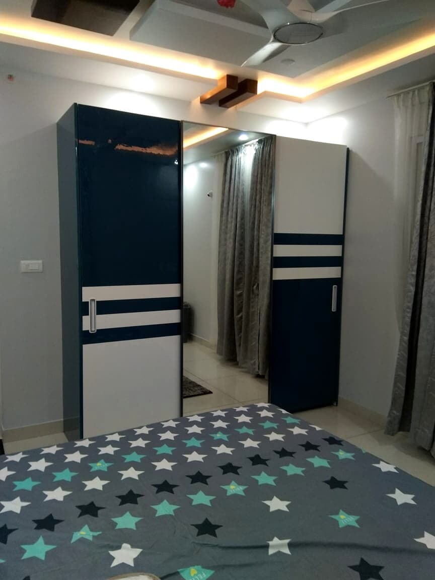 Kids Bedroom Teal White Wardrobe from an Abya completed interior project