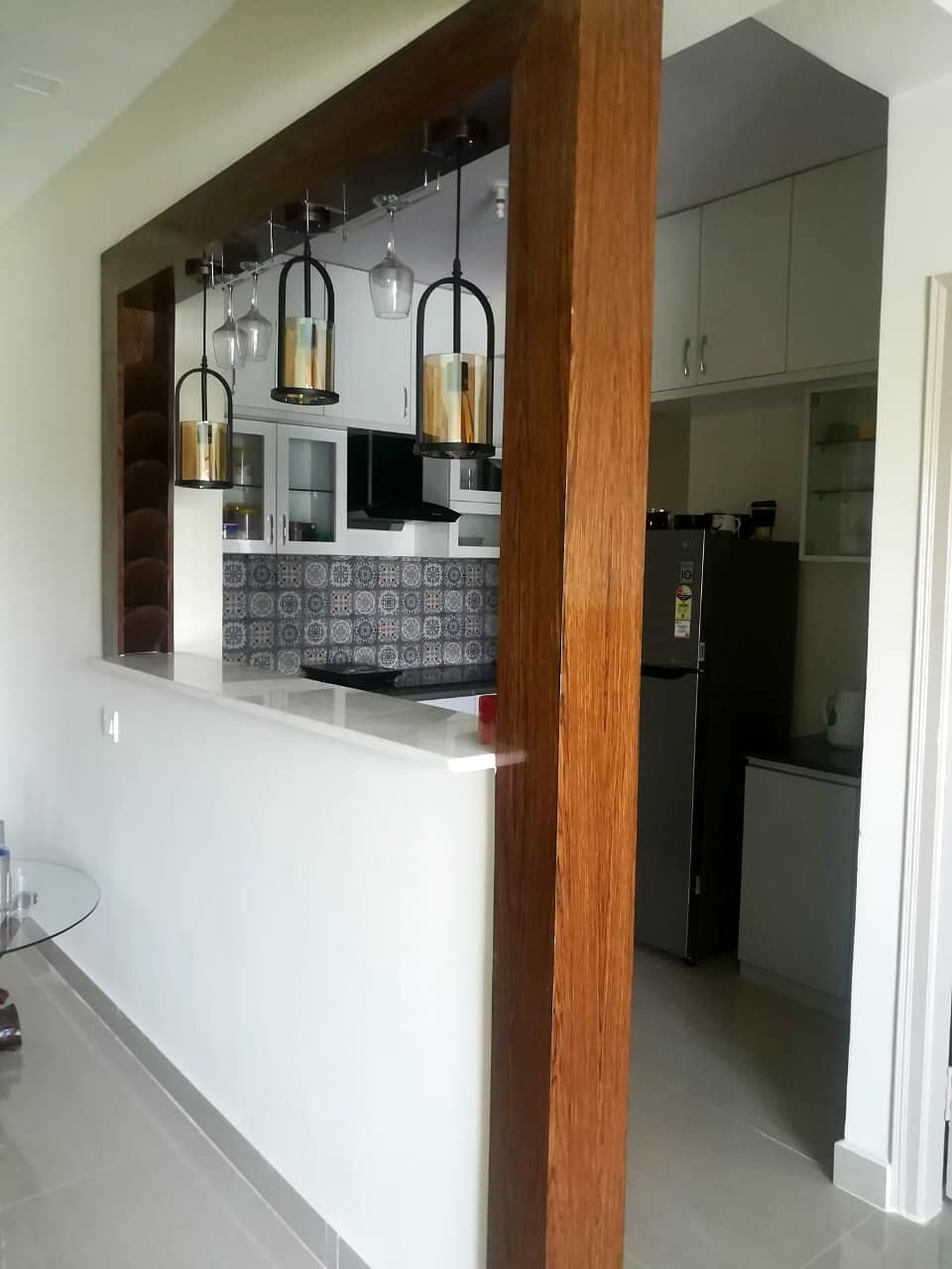 Kitchen Breakfast Counter Wood Partition from an Abya completed interior project