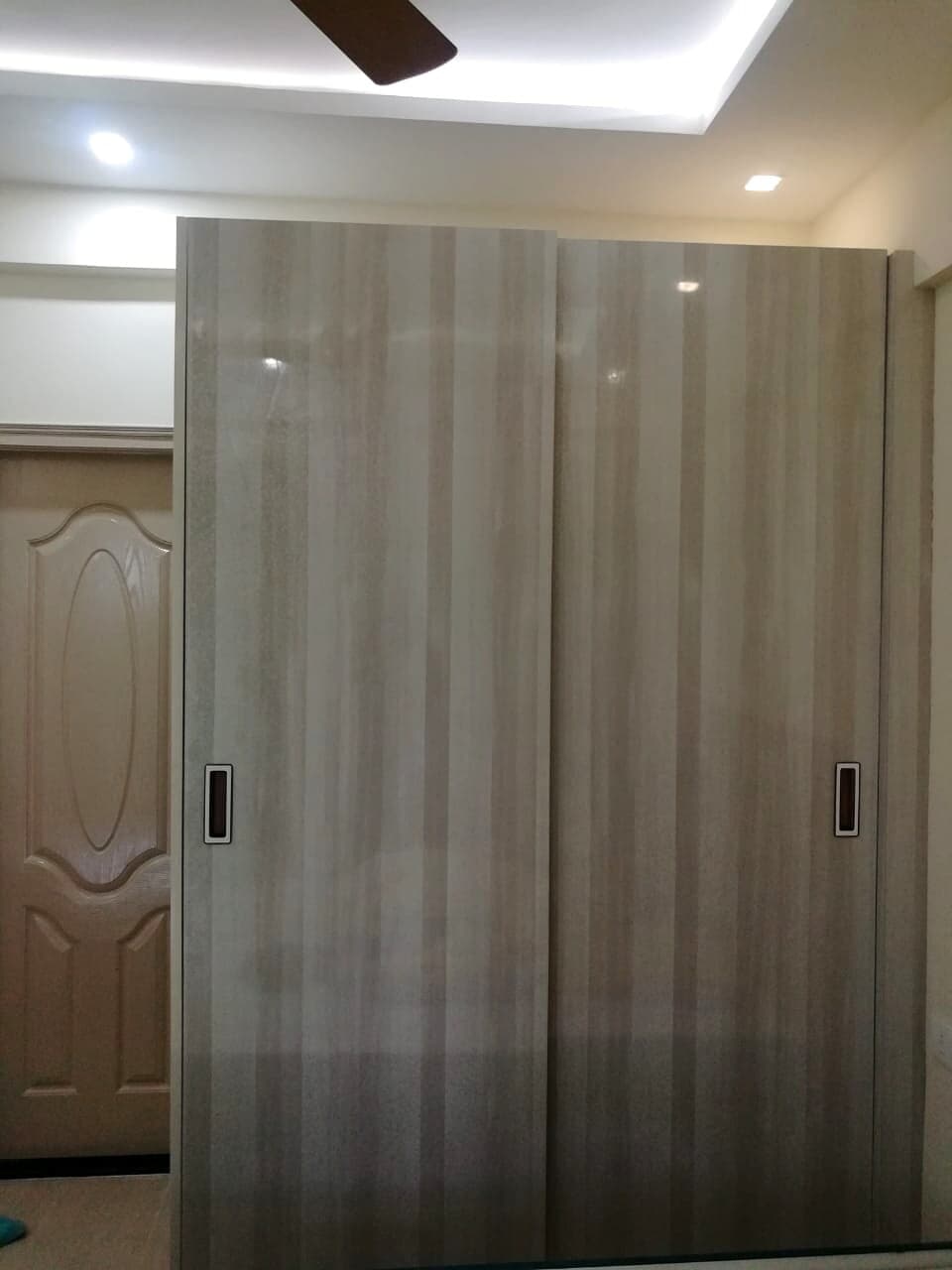 Light Wood Sliding Wardrobe from an Abya completed interior project