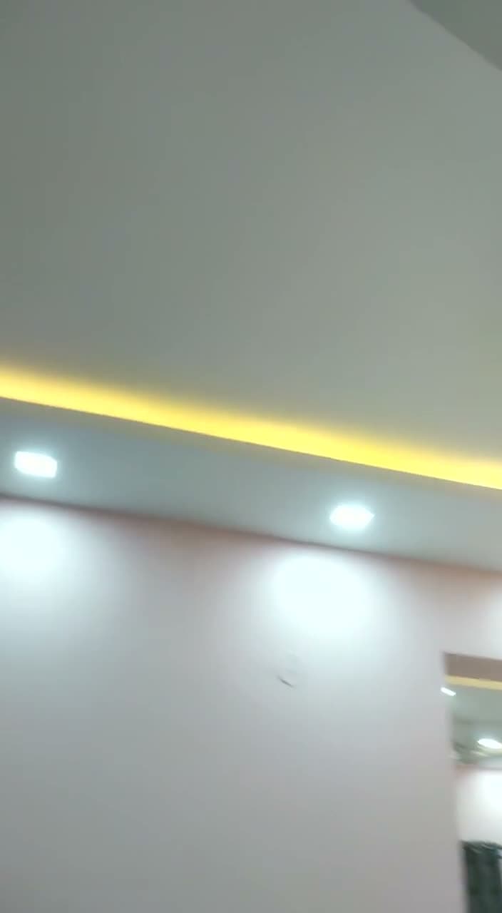 Living Room Tv Unit And Cove Ceiling Walkthrough Poster from an Abya completed interior project