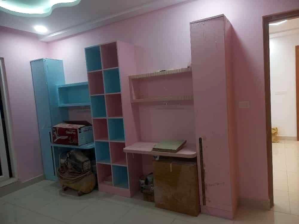 Pink Kids Room Shelves Desk from an Abya completed interior project