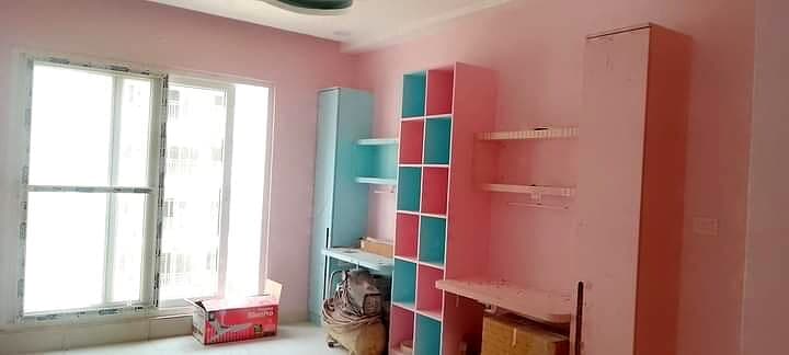 Pink Kids Room Study Shelves from an Abya completed interior project