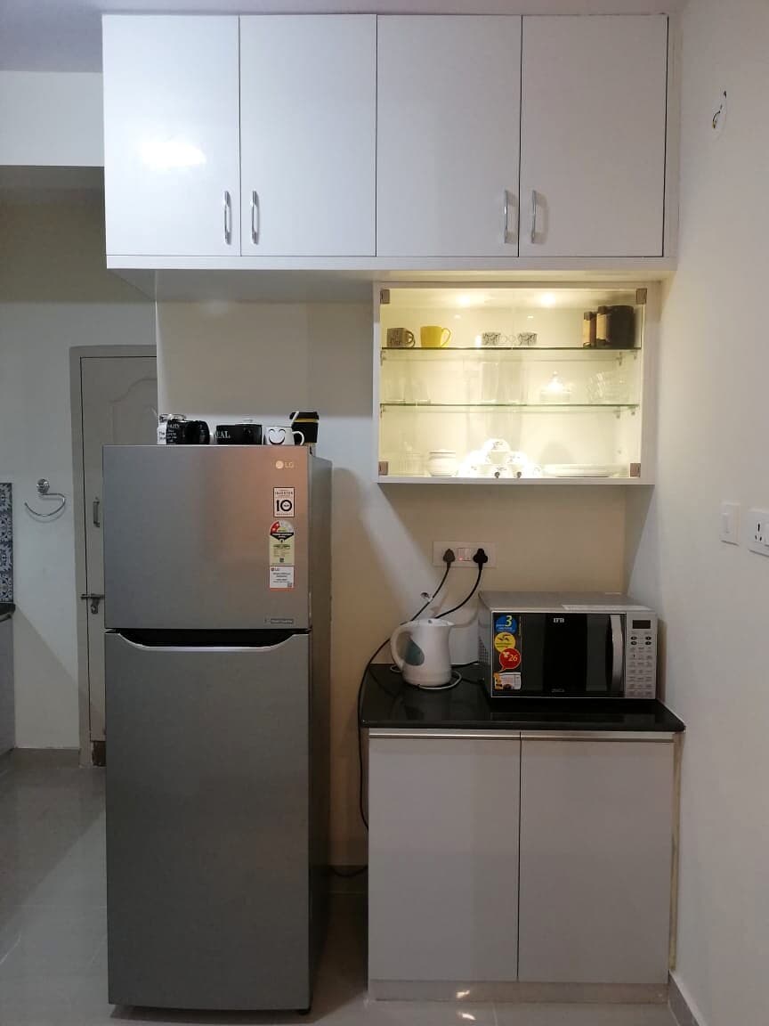 Refrigerator Kitchen Storage Cabinets from an Abya completed interior project