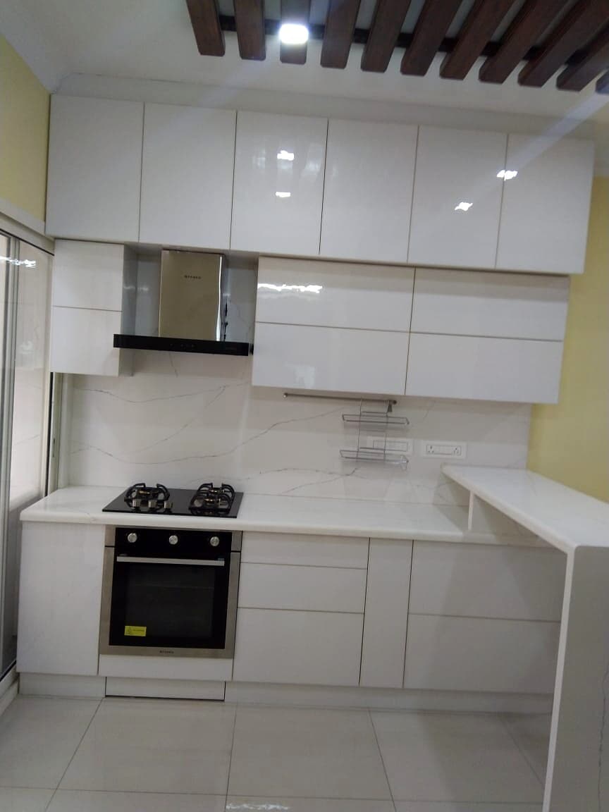 White Modular Kitchen Cabinets from an Abya completed interior project