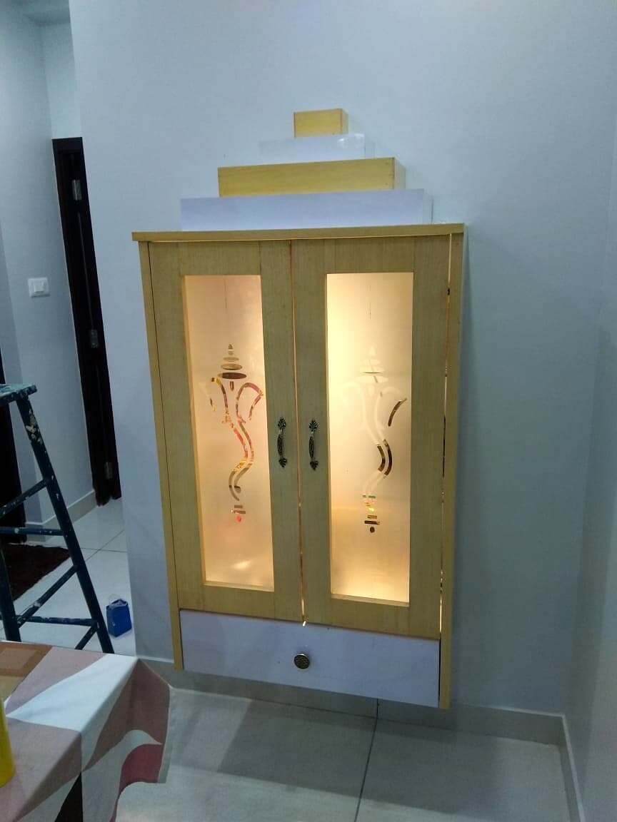 White Pooja Cabinet Floor Unit from an Abya completed interior project