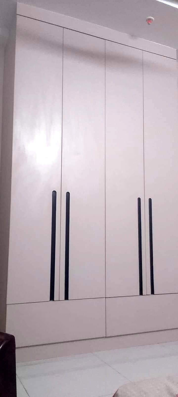 White Tall Wardrobe Long Handles from an Abya completed interior project