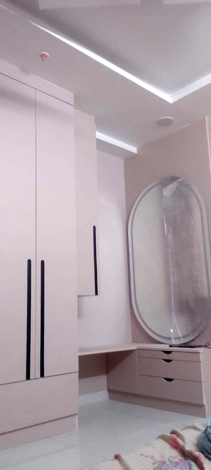 White Wardrobe Oval Mirror from an Abya completed interior project