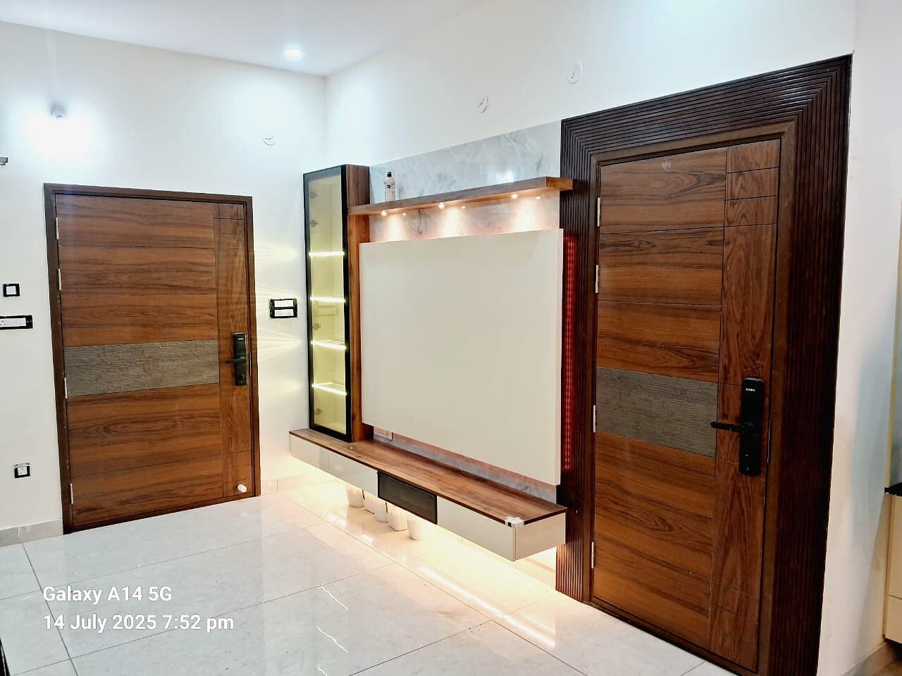 Wood Door Foyer Tv Panel from an Abya completed interior project